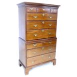 A Chippendale style George II mahogany tall boy, top section has three short over three long