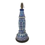 A Persian / Continental ceramic lamp base, wired for electricity in the early 20th century,