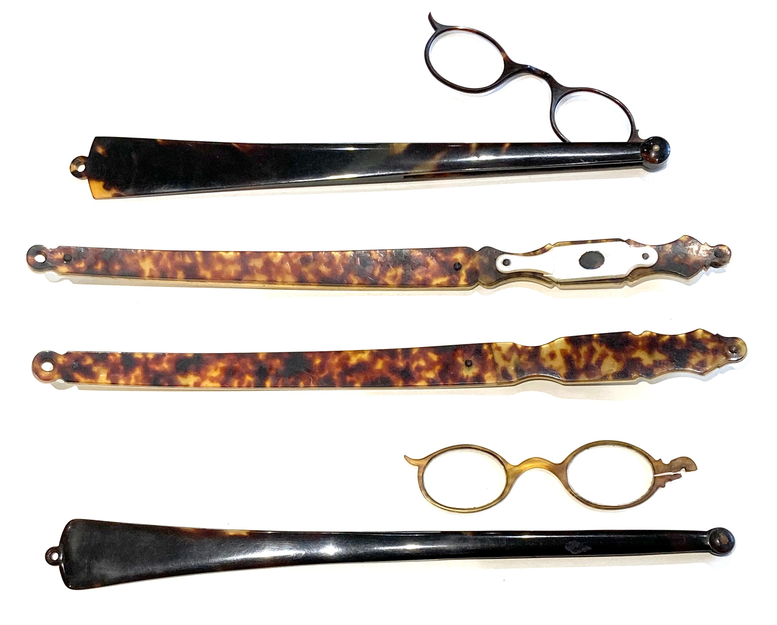 A group of four long handled folding spectacles, a/f damaged, two with curved handles only,