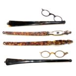 A group of four long handled folding spectacles, a/f damaged, two with curved handles only,