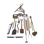 A cast iron surmount and a group of assorted tools