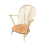 An Ercol elm and ash open armchair, 75 by 77 by 92.5cm high.