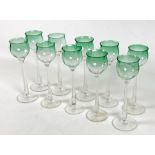 A set of ten 'Meteor' hock wine glasses, with green tulip shaped bowls and tapering stems, bowls 6.