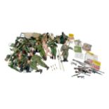 A collection of Action Man figures and accessories, including figures uniforms, weapons, medals,