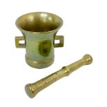 A 19th century heavy and brass pestle, 29.5cm long, together with a mortar, purported to be Russian,