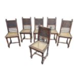 A set of six carved oak dining chairs, with carved backs and caned seats, turned legs with H form