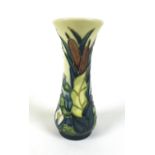 A Moorcroft Lamia vase, decorated with bulrushes and waterlilies, 13.2cm high.