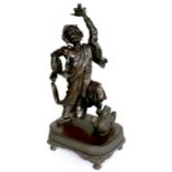 A late 19th century Japanese bronze sculpture, modelled as a man holding his left arm aloft, 48cm