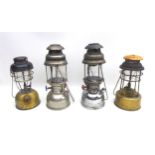 A group of four vintage paraffin lanterns, including a Hipolito H-502 Automatic, with Anchor 909