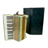 A vintage Hohner Tango piano accordion, with original case.