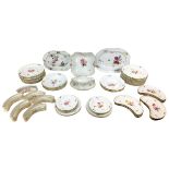 A collection of over fifty pieces of 19th century KPM Berlin porcelain, each piece individually