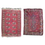 Two mid 20th century rugs, comprising a with red ground woollen rug with ten circular lozenges to