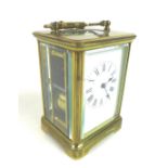 A 20th century brass carriage clock, with enamel dial and Roman numerals, blued steel hands, five