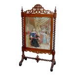 A Victorian mahogany firescreen, with a tapestry of King Charles I under arrest, bearing a 20th