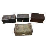 A group of vintage luggage, including three tin trunks. (4)