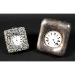 Two late Victorian silver cased travel clocks, both with easel frames and silver fronts, both