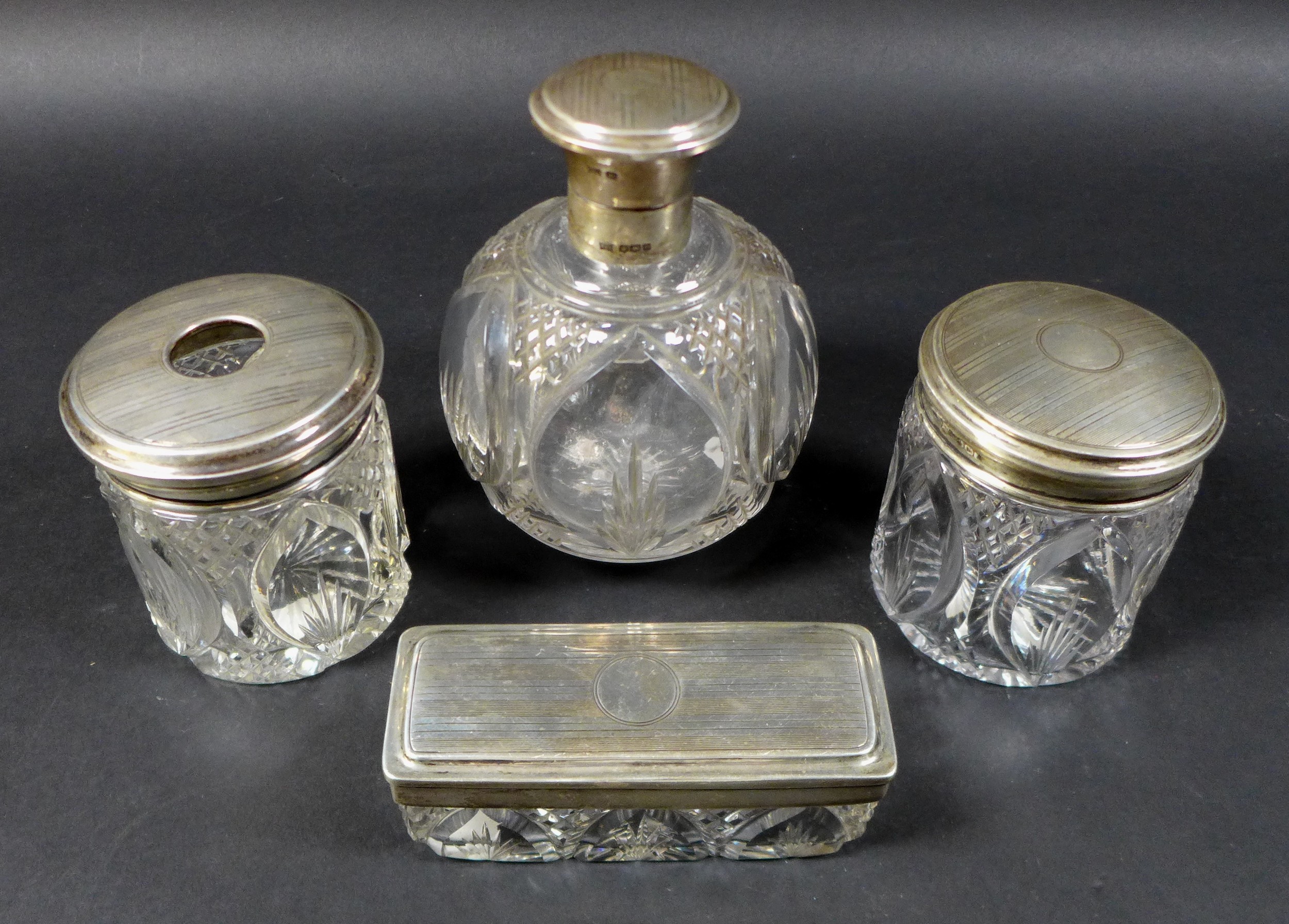 A collection of silver lidded cut glass dressing table jars, including a four piece set by - Image 2 of 7