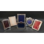 Six Edwardian and later silver photograph frames, including an Edwardian frame with ribbon