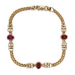 CATALOGUE AMENDMENT An Egyptian 18ct yellow gold, ruby and garnet bracelet