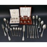 A group of mixed silver flatware, including two cased sets of coffee spoons, and a butter