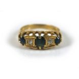 An 18ct gold sapphire and diamond ring, the largest oval cut sapphire, approximately 4 by 5mm,
