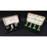 Two silver cruet sets, comprising an Edwardian set of four pepper pots, Colen Hewer Cheshire 1909,