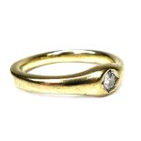 A 9ct gold diamond solitaire gypsy ring, stone approximately 3mm diameter, size T, 5.8g.