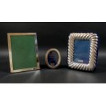 Three ERII silver photograph frames, the largest of rectangular form, 15.5 by 20.5cm, Whitehall