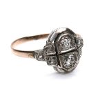 An Art Deco 14k gold and diamond ring, the two principle round cut diamonds 2.5 by 1.7mm, flanked by