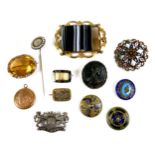 A group of twelve brooches, buttons and a stick pin, 18th century and later, including a Roman