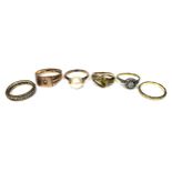 A group of six gold and yellow metal dress rings, including a 9ct gold gypsy ring, size S, 2.6g,