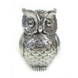 A white metal owl figurine, possibly stamped '925', 1.95toz, 6 by 6 by 9cm high.