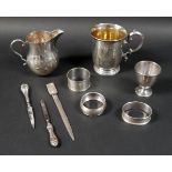 A small group of silver items, comprising a Victorian christening mug, engraved 'Helen', 10cm