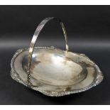 An Edwardian silver swing handle fruit bowl, with cast rim, raised on an oval foot, Atkin