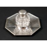 A Victorian silver inkwell, with octagonal dish stand, cut glass bottle and hinged cover, Henry
