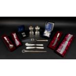 A collection of ERII silver, including a pair of napkin rings with case and still in plastic