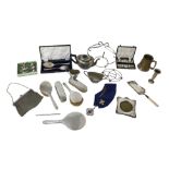 A collection of silver and silver plated wares, including a silver backed dressing table set, a