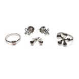 Two pairs of silver stud earrings, one of teardrop design, the other of open flower design, 0.9cm,