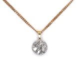 A 9ct gold and diamond pendant, of target design set with seven round cut diamonds in a white gold