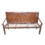 An 18th century oak settle, seven panel back, with rope seat, a/f, 179 by 55 by 104cm high.