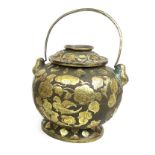 A gilt metal temple incense lidded pot, of ovoid form with loop handle, 17 by 16cm high.