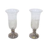 A pair of modern candlesticks, with flared glass shades and engraved decoration, silver plated