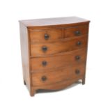 A Victorian bow fronted mahogany chest of drawers, with two over three graduating drawers with