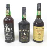 Three bottles of vintage port, including a Kopke 1981, Ferreira Porto, and Graham's 1982. (3)