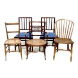 A group of five chairs, comprising an 18th century oak Windsor side chair, an Edwardian mahogany