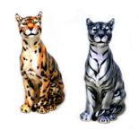 Two modern Italian ceramic floor standing sculptures, modelled as a leopard and a silver tiger, with