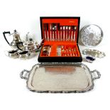 A group of silver plate wares, including a canteen of cutlery, twin handled tray, and a part tea