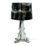 A Kartell Bourgie perspex table lamp, silvered finish, designed by Ferruccio Laviani, 32 by 69cm