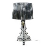 A Kartell Bourgie perspex table lamp, silvered finish, designed by Ferruccio Laviani, 32 by 69cm