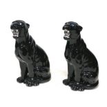 Two modern Italian ceramic floor standing sculptures, modelled as black panthers, with inset '